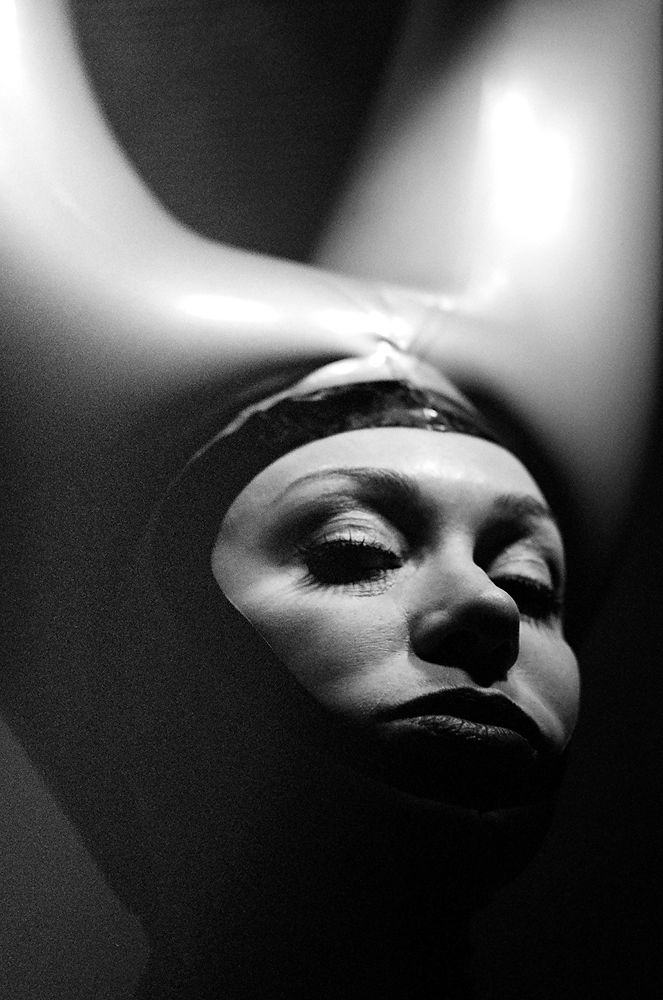 Film Noir inspired portrait of woman wearing inflatable horns.