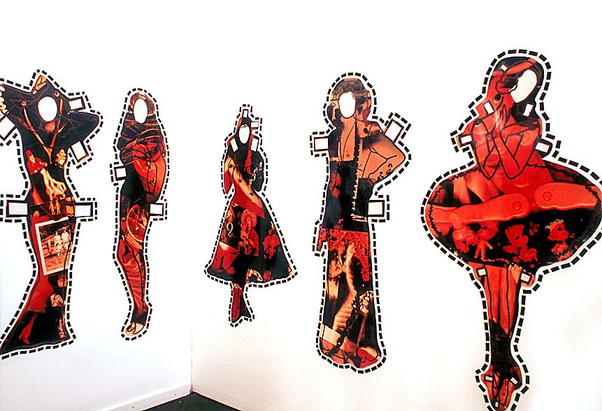 The paper doll's dresses represent interchangeable identities, acting as powerful vehicles to communicate the complexity inherent in women's roles.